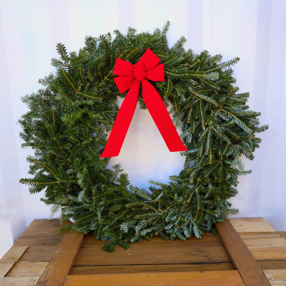 fresh 36 inch Fraser fir wreath with cool blue green foliage and a festive red bow
