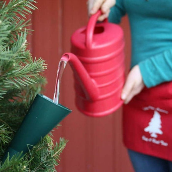 watering elf is a funnel that helps you water your christmas tree without mess