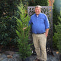 woodie with our 4-5 ft tall leyland cypress in a nursery pot