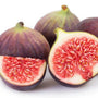 Ripe purple chicago hardy figs sliced open showing red fruit flesh