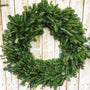 a fraser fir wreath undecorated as a rustic holiday decoration