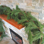 Fresh White Pine Garland on Decorated Fireplace Mantle